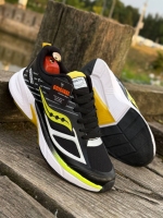 کتونی اسپرت Saucony مشکی زرد